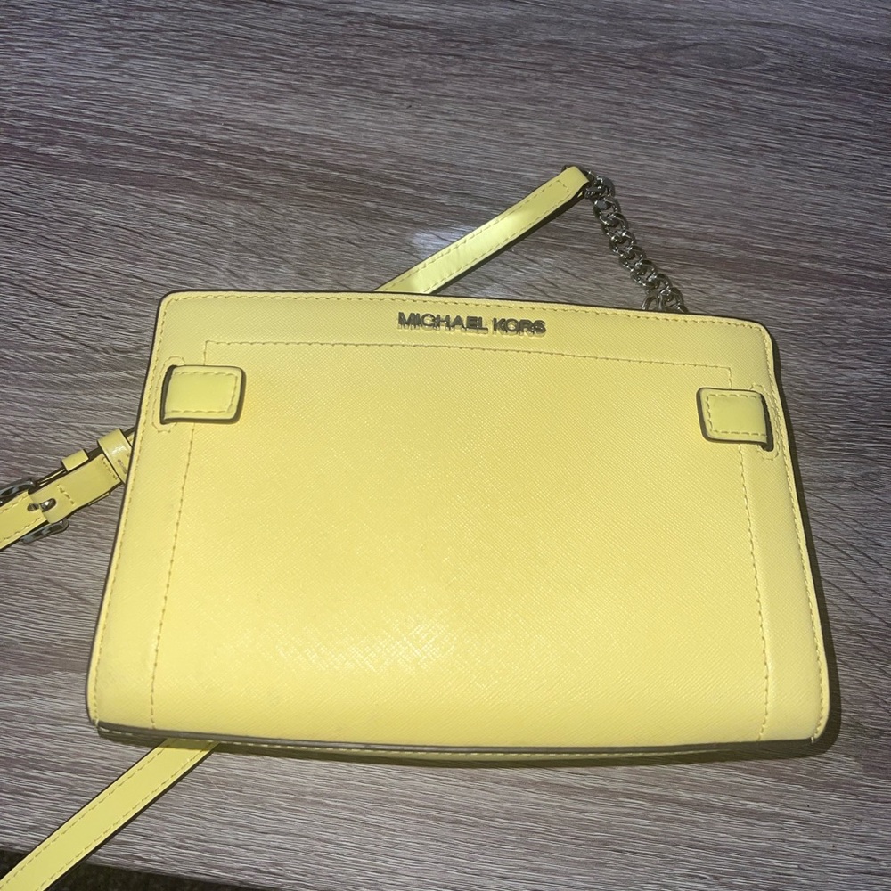 Bright yellow Michael Kors cross body purse